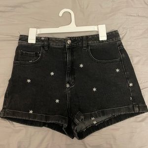 black denim high waisted shorts with daisy details